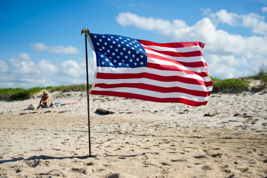 flag on beach, outer banks memorial day rentals